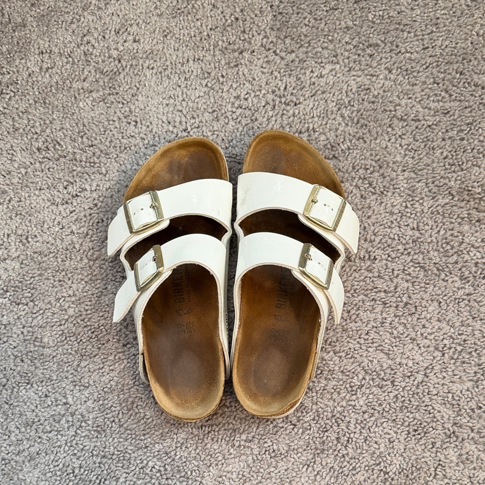 Birkenstock White Two-Strap Sandals with Gold Buckles